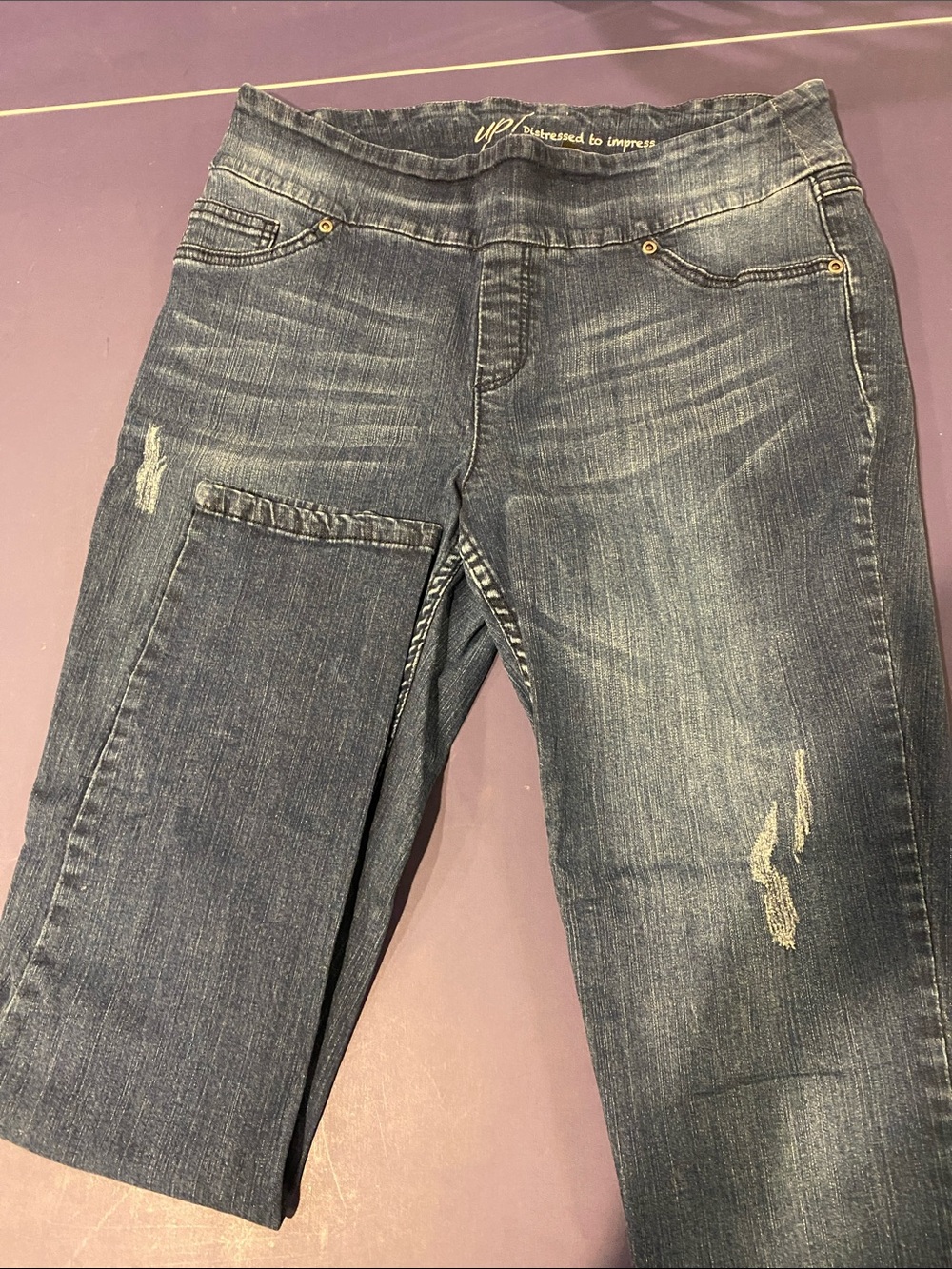 Womenโs Dark Wash Stretch Jeggings with Light Distressing - Blue